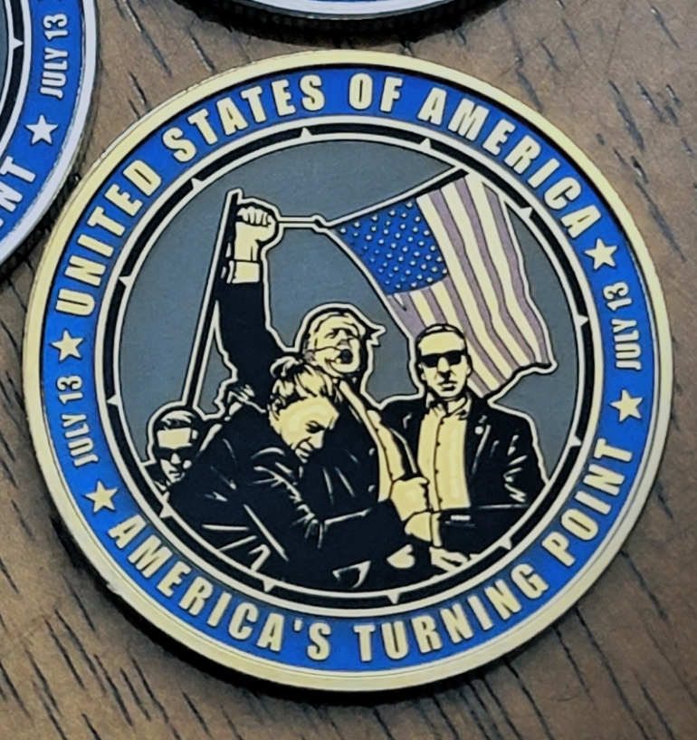 This is our 40mm gold-plated 2024 Corey Comperatore Trump Challenge Coin. Includes acrylic protective capsule with each coin.  Each coin is individually created with a specialty laser. Each coin takes about 2 hours to engrave. 