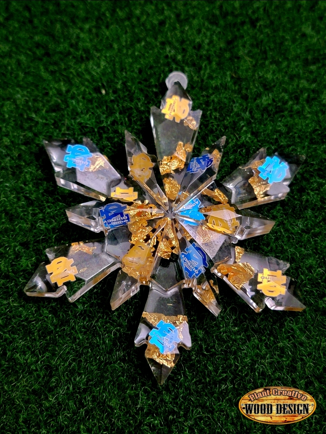 4.5" epoxy snowflakes with custom engraved/cut metal QND logos and sport ball (put into comments which one) inside of the snowflake cut from thin metal. If only want QND logo, type into comment section "NO SPORT". ONE OF A KIND