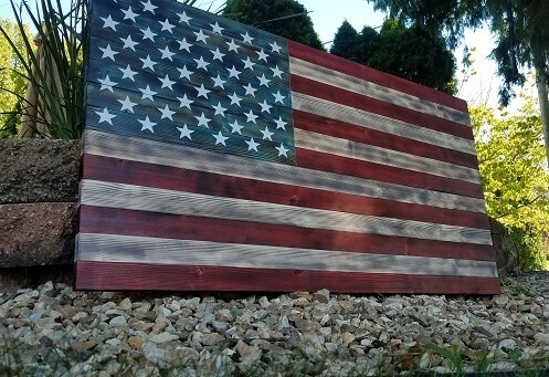 Distressed stained American Flag. This beauty will make a statement when everybody sees it. 
***I have committed to putting a good portion of the profits from every single one of these flags i sell to produce the same wooden flags, completely free, to var