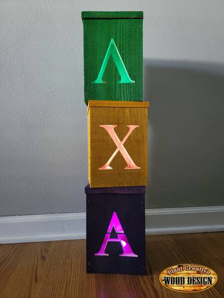 Cedar painted frat/sorority letter lanterns. Up to 3 lanterns included with 1 letter on the face of each lantern. 